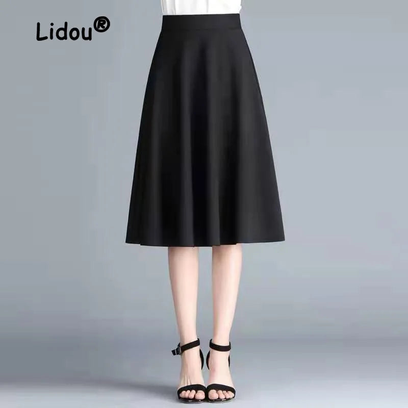 Solid Color Elastic A-Line Midi Skirt — Office Versatile